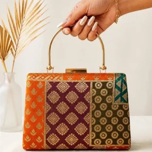 Clutiva orange and purple brocade luxury party clutch for women with gold handle