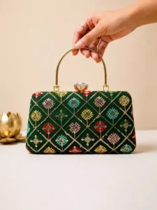Green Geometric: Clutiva emerald green party clutch for women with diamond pattern threadwork.