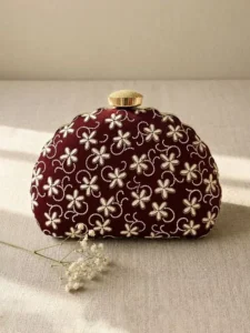 Maroon Floral Image: Clutiva maroon velvet party clutch for women with white floral embroidery.