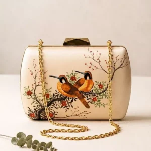 Elegant cream satin clutch bag featuring vintage orange birds and blossom branch artwork