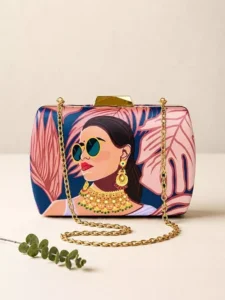 Clutiva luxury tropical printed satin box clutch featuring a modern Indian portrait with sunglasses and traditional jewelry.
