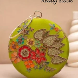 Clutiva round ethnic clutch available in rose pink and lime green, featuring intricate multi-color floral machine embroidery and a crystal-studded circle handle.