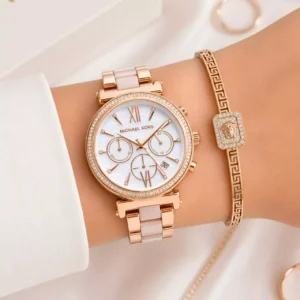 Handheld presentation showing the intricate multi-dial chronograph face and the detailed dual-tone rose gold and blush pink acetate bracelet links.