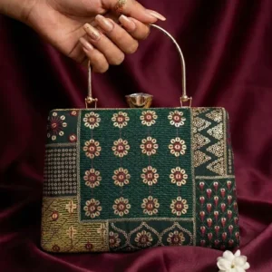 Emerald embroidered designer clutch held by hand with gold chain handle – Clutiva