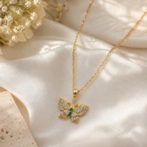 Clutiva Emerald Butterfly Crystal Pendant Necklace in premium gold finish with emerald green stones and sparkling crystals on an anti-tarnish stainless steel chain.