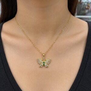 Clutiva Emerald Butterfly Crystal Pendant Necklace in premium gold finish with emerald green stones and sparkling crystals on an anti-tarnish stainless steel chain.